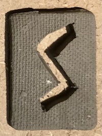 the letter z on a piece of wood