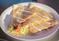 a plate of quesadillas on a table