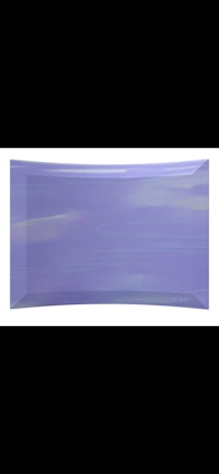 a purple glass plate on a white background