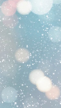 a snowy background with bokeh lights