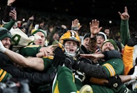 the green bay packers celebrate after winning the nfl championship