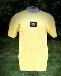 a yellow t - shirt with a crown on it