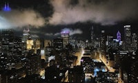 chicago skyline at night with clouds in the sky