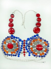 a red, orange and blue necklace with a chain