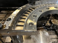 a machine is being used to make a metal ring