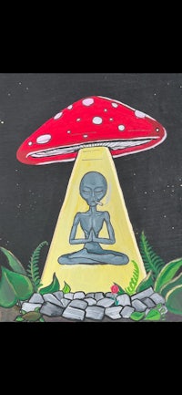 a painting of an alien sitting on a mushroom