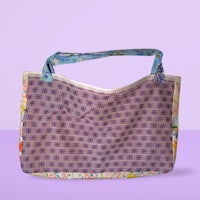 a purple and blue tote bag on a purple background