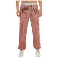 a man wearing a pink sweatpants with the word thug life on them