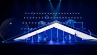 an image of a stage with blue lights on it