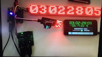 a led display with a clock attached to it