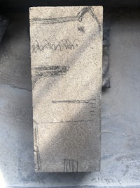 a drawing on a piece of concrete