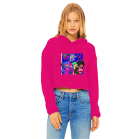 a woman wearing a pink cropped hoodie with cartoon characters on it
