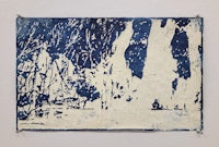 a blue and white painting hanging on a wall