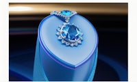 an image of a blue topaz and diamond pendant