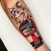 a tattoo of a man with a tv on his forearm