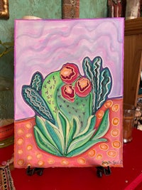 a painting of a cactus on a table