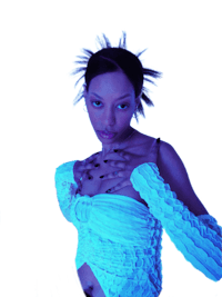a woman in a white dress posing in front of a blue light