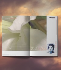 the cover of a magazine with a photo of a white flower