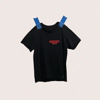 a black t - shirt with red and blue tape on it