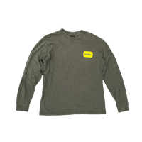 a grey long - sleeve t - shirt with a yellow patch on it