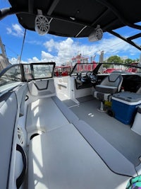 the interior of a boat with seats and a console
