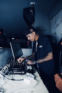 a dj is mixing music in a room