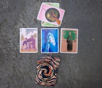 a set of tarot cards on the ground