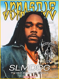 the cover of slmdg magazine featuring a man with dreadlocks