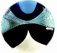 a blue and black glass plate on a white background
