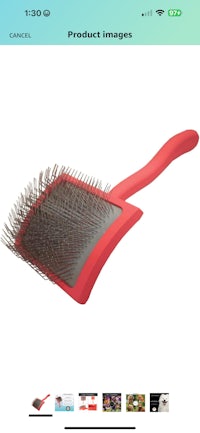 a red brush with a red handle is shown on the screen