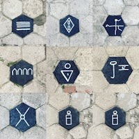 a group of hexagonal signs on a sidewalk