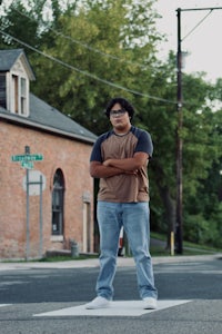 a man standing on a crosswalk