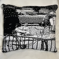 a black and white pillow with a picture of a car