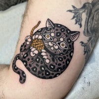 japanese cat tattoo on the arm