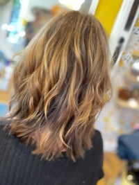 the back of a woman's hair in a salon