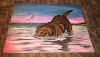 a painting of a brown dog swimming in the ocean