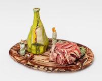 a sculpture of a bottle of wine and a piece of meat on a wooden board
