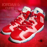 a pair of red jordan 6 cupids on a red background