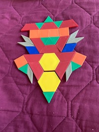 a set of colorful geometric shapes on a bed