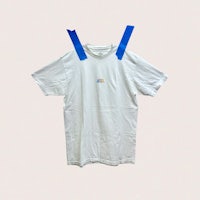 a white t - shirt with blue tape on it