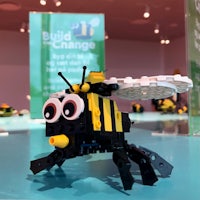 a lego bee on display at a museum