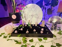 a display of crystals and plants on a table