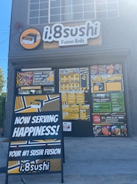 a sign for i8 sushi in front of a store