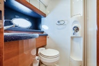 a bathroom in a boat with a toilet and sink