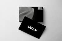 a black and white business card with the word lecn