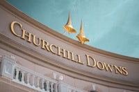 the churchill downs sign is on top of a building