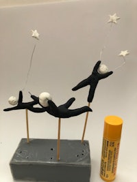 a set of figurines with stars and a bottle of lip balm