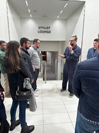 a group of people standing in an elevator