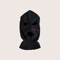 a black knitted mask with red letters on it