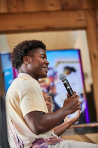 a young man speaking into a microphone